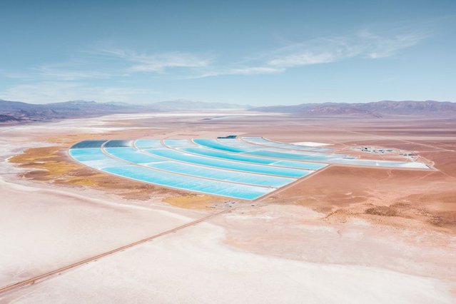 View of a Lithium Mine that looks like a blue salt field in a large dessert, picture from above