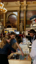People playing a game in a grand hall