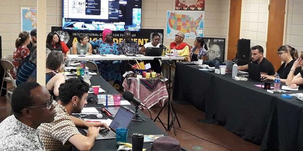 People sitting on tables working