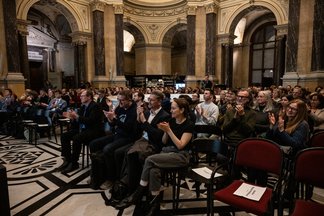 The audience in the Dome Hall clapping